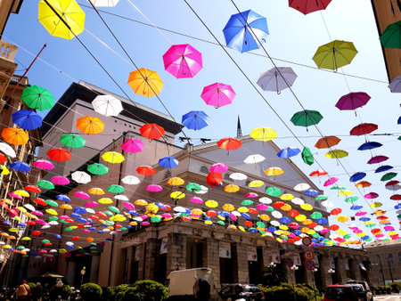 Genoa, Italy - 04/06/2019: Rainbow gay pride protection symbol in hanging umbrellas over the cityのeditorial素材