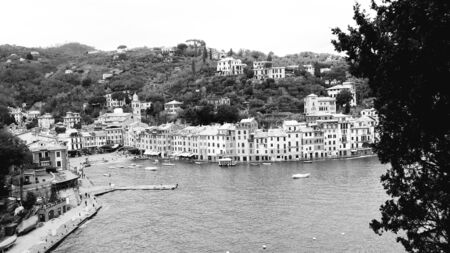 Genoa, Italy - 11/15/2019: Close-up of big waves breaking on the coast in Liguria, Italy, Europe. White waves on the cliff.の写真素材