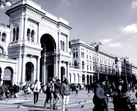 Milan, Italy - 12/25/2019: An amazing caption of the Duomo of Milan in winter days with some people enjoying the evening and beautiful black and white background, and beautiful photo of some skylinesのeditorial素材