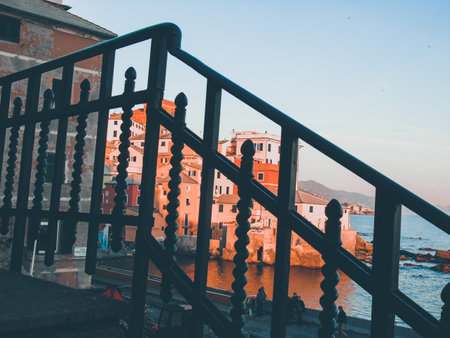 Genova, Italy - 04/20/2020: Editing some old photos of the city of Genova from home with basic...