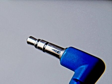 Detailed photography of black and blue earphones with white background