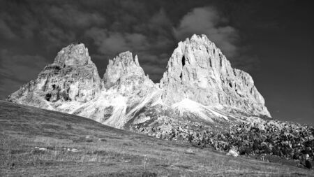 Trentino Alto - Adige, Italy - 06/15/2020: cenic alpine place with magical Dolomites mountains in the background, amazing clouds and blue sky in Trentino Alto Adige region, Italy, Europeの写真素材