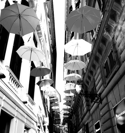 Genova, Italy - 06/01/2020: Bright abstract background of jumble of rainbow colored umbrellas over the city celebrating gay prideのeditorial素材