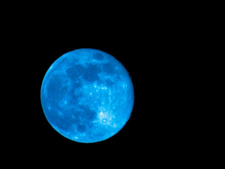 Earth's Moon Glowing with different colors in the Background. Blue and red moon watched by telescope.の写真素材