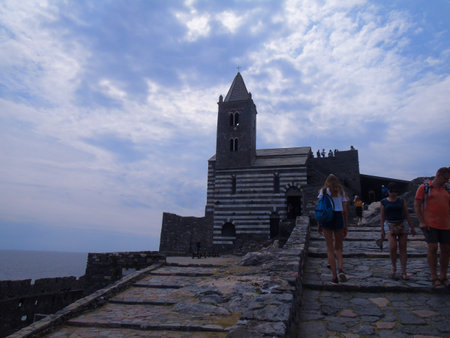 Liguria, Italy - June 15, 2020: Traveling around the ligurian seaside. Panoramic view to the seaside and the old villages. An amazing caption of the medieval colored houses with gray sky.のeditorial素材