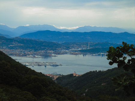 Liguria, Italy - June 15, 2020: Traveling around the ligurian seaside. Panoramic view to the seaside and the old villages. An amazing caption of the medieval colored houses with gray sky.のeditorial素材