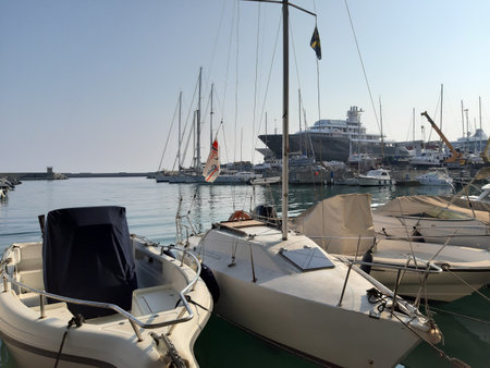 Liguria, Italy - June 17, 2021: Traveling around the ligurian seaside. Panoramic view to the seaside and the old villages. Beautiful view to the port with some boats in summer daysのeditorial素材
