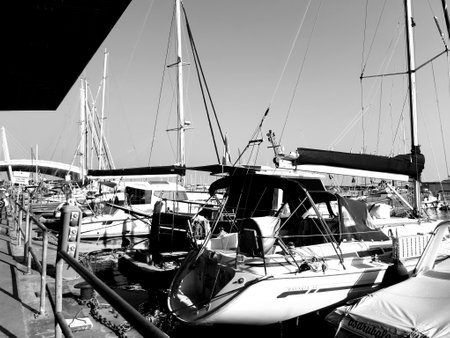 Liguria, Italy - June 17, 2021: Traveling around the ligurian seaside. Panoramic view to the seaside and the old villages. Beautiful view to the port with some boats in summer days.のeditorial素材