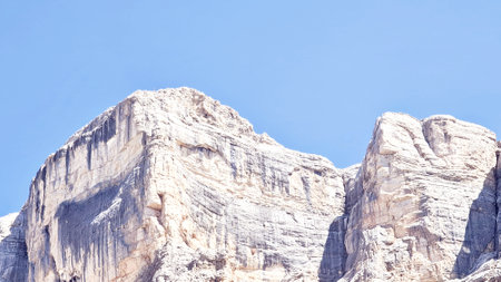 Val Badia, Italy-July 18, 2022: The italian Dolomites behind the small village of Corvara in summer days with beaitiful blue sky in the background. Green nature in the middle of tの写真素材