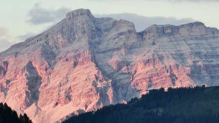 Val Badia, Italy-July 18, 2022: The italian Dolomites behind the small village of Corvara in summer days with beaitiful blue sky in the background. Green nature in the middle of thの写真素材