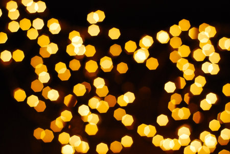 bokeh of many orage lamp on black background in beatiful nightの写真素材