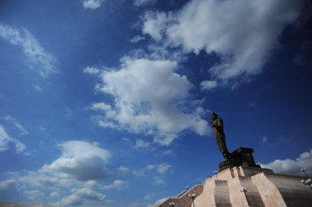 Image of buddha stand is the sign symbol peace Buddhism and religion of thailand on blue sky cloud background day prepare for worship outdoor locationの写真素材