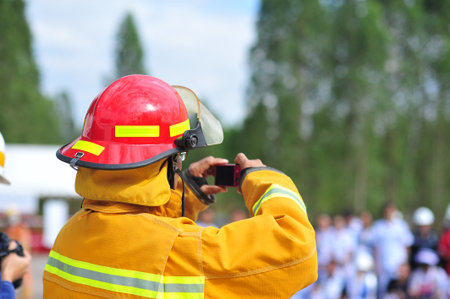 the group of firefighters man are inject spray the water to fire accident on building