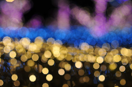 Blur focus of light on black background from lamp in nightの写真素材