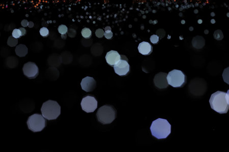 Blur focus of light on black background from lamp in night on Christmas before new year 2018 so beautiful romantic holidayの写真素材
