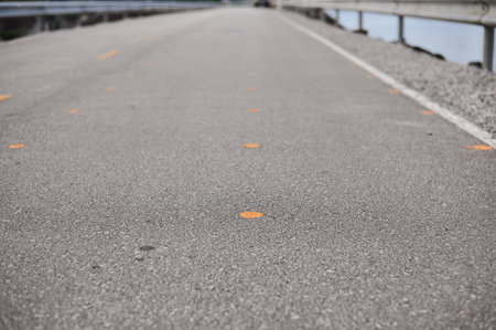the yellow and white line on highway road is the direction of lane for safety travel