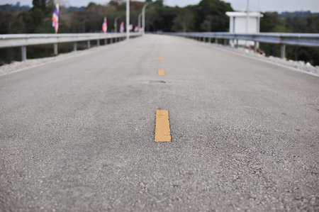 the yellow and white line on highway road is the direction of lane for safety travelの写真素材
