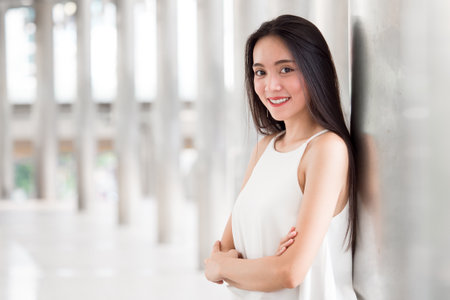 Portrait young beautiful asian business woman on city background.の写真素材