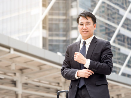 Portrait middle aged asian businessman in the city, businessman, manager, boss handsome looking in the city concept.の写真素材