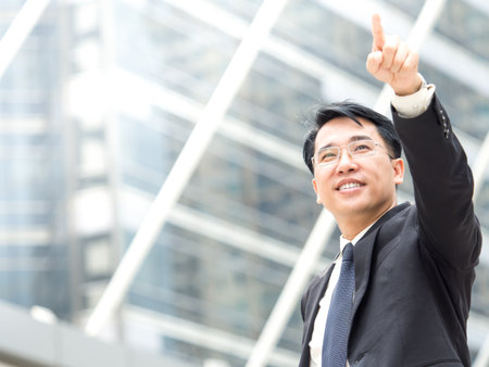 Portrait middle aged asian businessman in the city, businessman, manager, boss handsome looking in the city concept..の写真素材