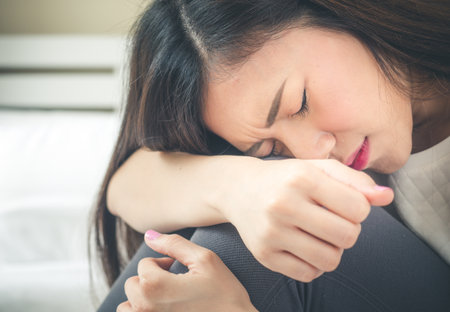 Young asian woman crying and feeling sad and down.の写真素材