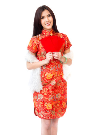 Chinese new year woman concept, isolated asian woman wearing red dress Cheongsam holding money gift.の写真素材
