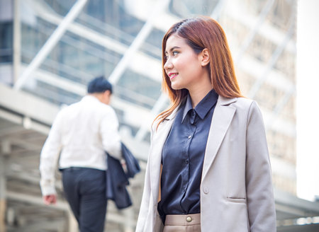 Portrait young Asian businesswoman holding in formal suit at the modern city, vintage toneの写真素材