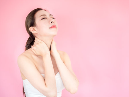 Beautiful asian woman on pink background, make up, healthy skin, beauty, cute asian woman conceptの写真素材