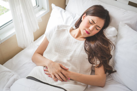 Asian woman stomachache, feel pain for period conceptの写真素材