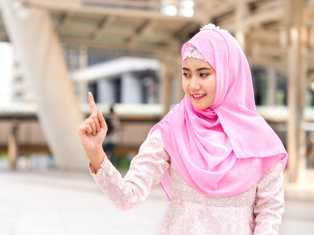 Portrait of young beautiful arabian woman, businesswoman in the city, Professional, smart and confidential businesswoman conceptの写真素材