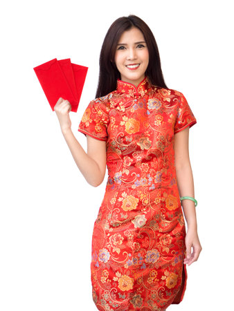 Chinese new year woman concept, isolated asian woman wearing red dress Cheongsam holding money gift.の写真素材