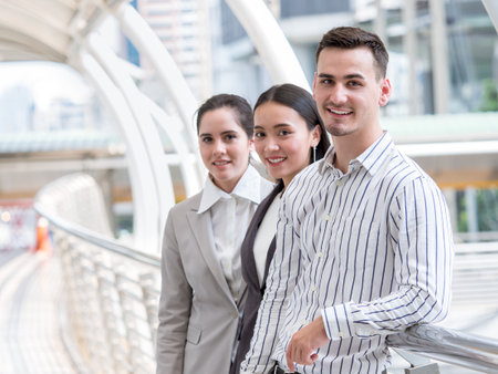 Group of young caucasian business people in the city with successful and confident feelingの写真素材