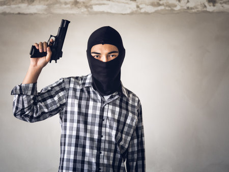 Portrait terrorist man holding gun, carbine and machine gunの写真素材