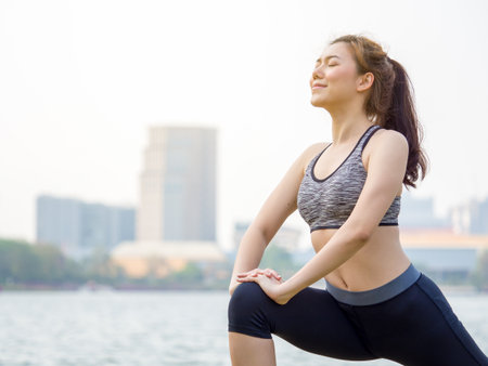 Woman fitness outdoor concept, young asian beautiful woman/sport girl running walking and yoga at outdoor park with fresh, relax, happy feeling.の写真素材