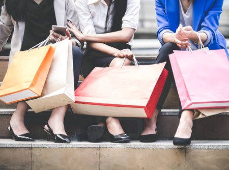 Woman shopping concept, asian woman holding colorful shopping bags in the city/shopping mall, vintage toneの写真素材