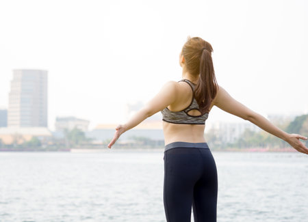 Woman fitness outdoor concept, young asian beautiful woman/sport girl running walking and yoga at outdoor park with fresh, relax, happy feeling.の写真素材