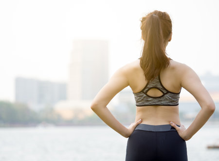 Woman fitness outdoor concept, young asian beautiful woman/sport girl running walking and yoga at outdoor park with fresh, relax, happy feeling.の写真素材