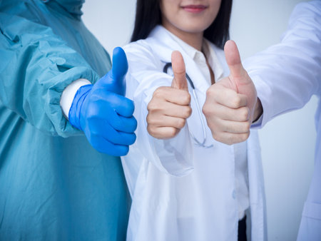 Team work doctors tumb up for medical conceptの写真素材
