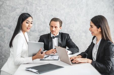 Asian business woman discussing/job interview with colleauge/boss for business meeting and presentationの写真素材
