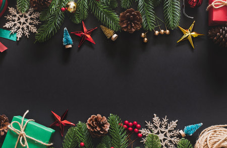 Christmas background with christmas decoration over black background with copy space. top view flatlayの写真素材