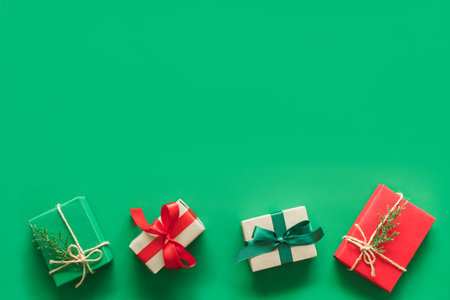 Christmas background with gift present over green background with copy space. flatlay topviewの写真素材