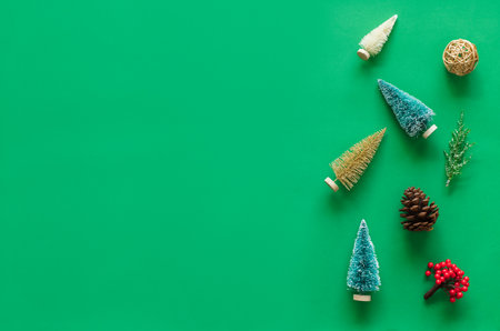 Christmas background, frame with fir branches tree pinecone over green background. flatlay copy spaceの写真素材