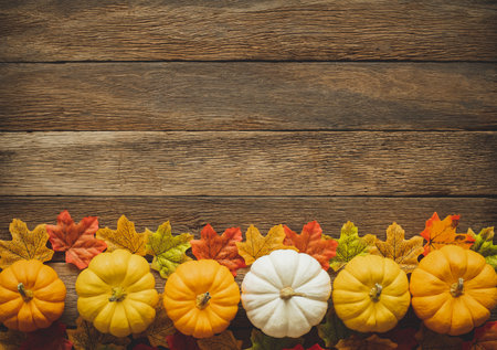Thanksgiving background, pumpkin, leaves and decoration on wood table background with copy space. flatlayの写真素材