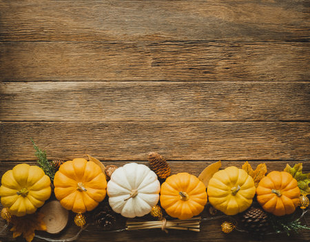 Thanksgiving background, pumpkin, leaves and decoration on wood table background with copy space. flatlayの写真素材