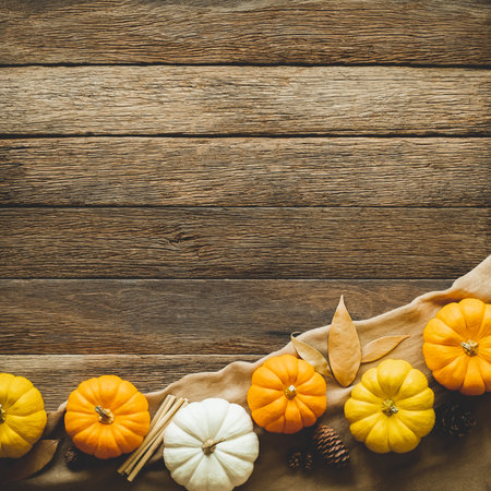 Thanksgiving background, pumpkin, leaves and decoration on wood table background with copy space. flatlayの写真素材