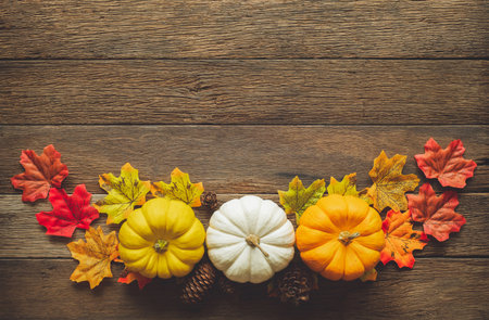 Thanksgiving background, pumpkin, leaves and decoration on wood table background with copy space. flatlayの写真素材