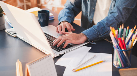 Business people working on laptop   at home, quarantine from coronavirus covid-19, work from home or work at home and social distancing conceptの写真素材