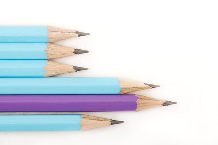 Blue pencils and one purple standing outの写真素材