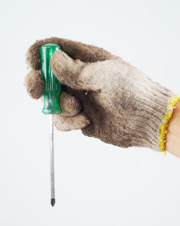 Screw driver in hand workers on white backgroundの写真素材