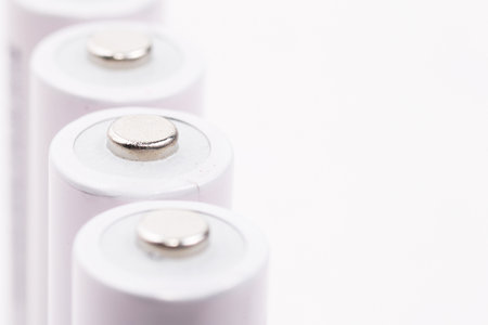 close-up of white cell batteries on isolated white backgroundの写真素材